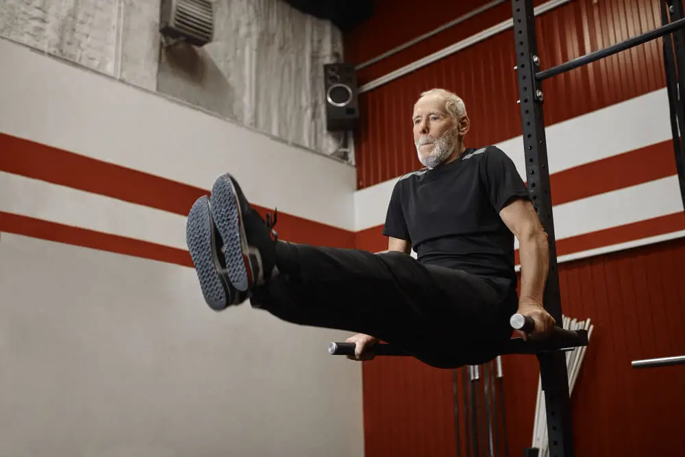 old man doing crossfit exercises