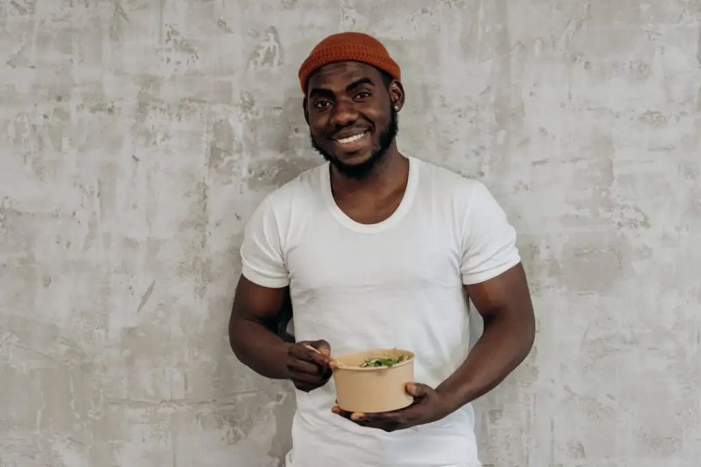 buff guy holding bowl