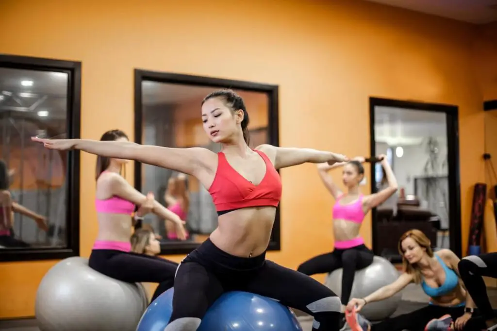 ectomorph women practicing pilates on fit balls