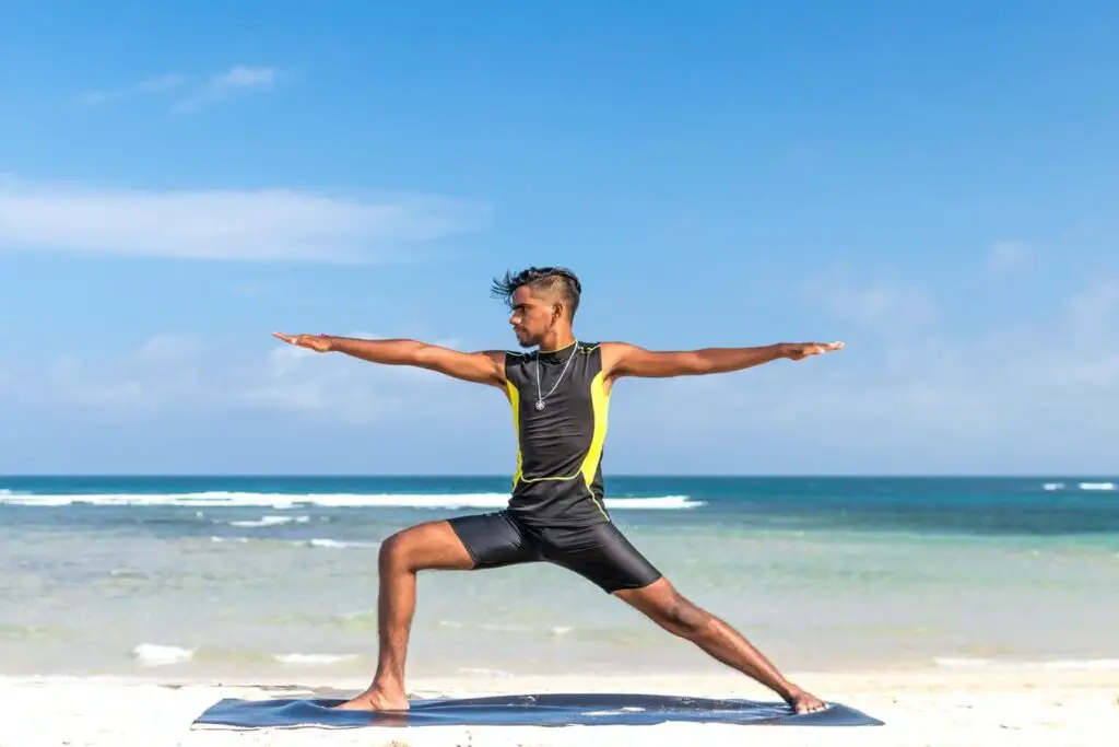 is pilates good for ectomorphs: man doing pilates in beach