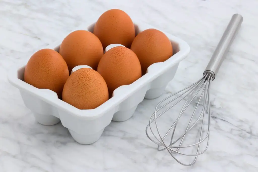 six eggs with tray