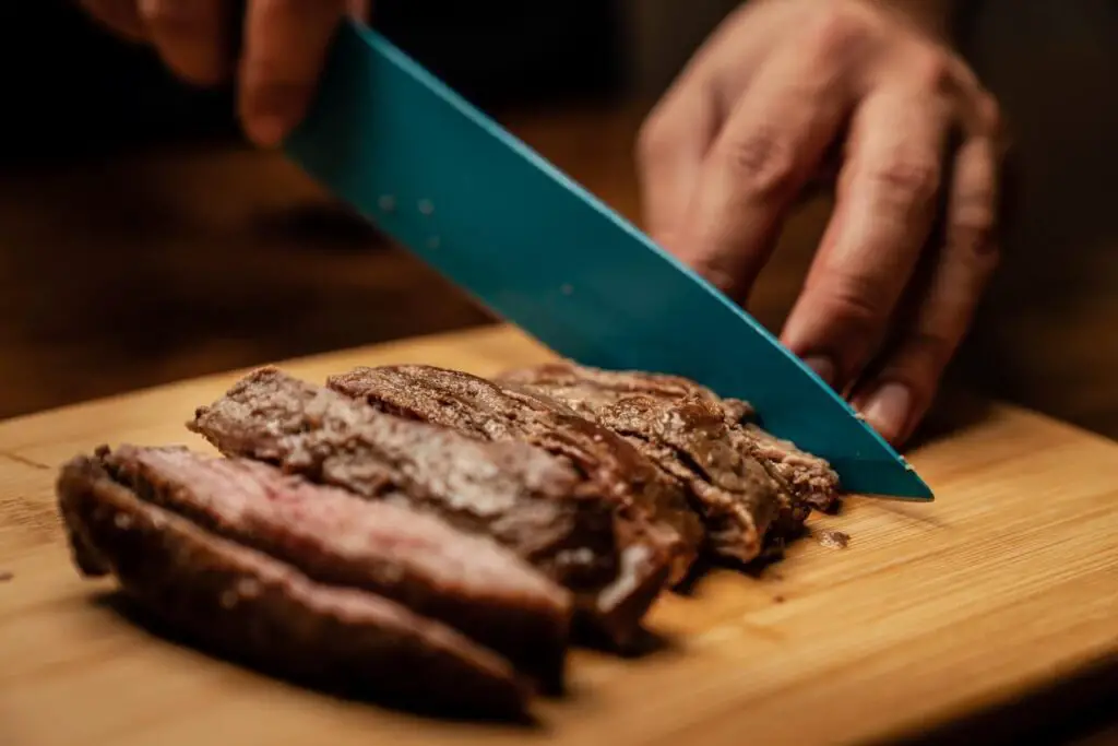 person chopping meat