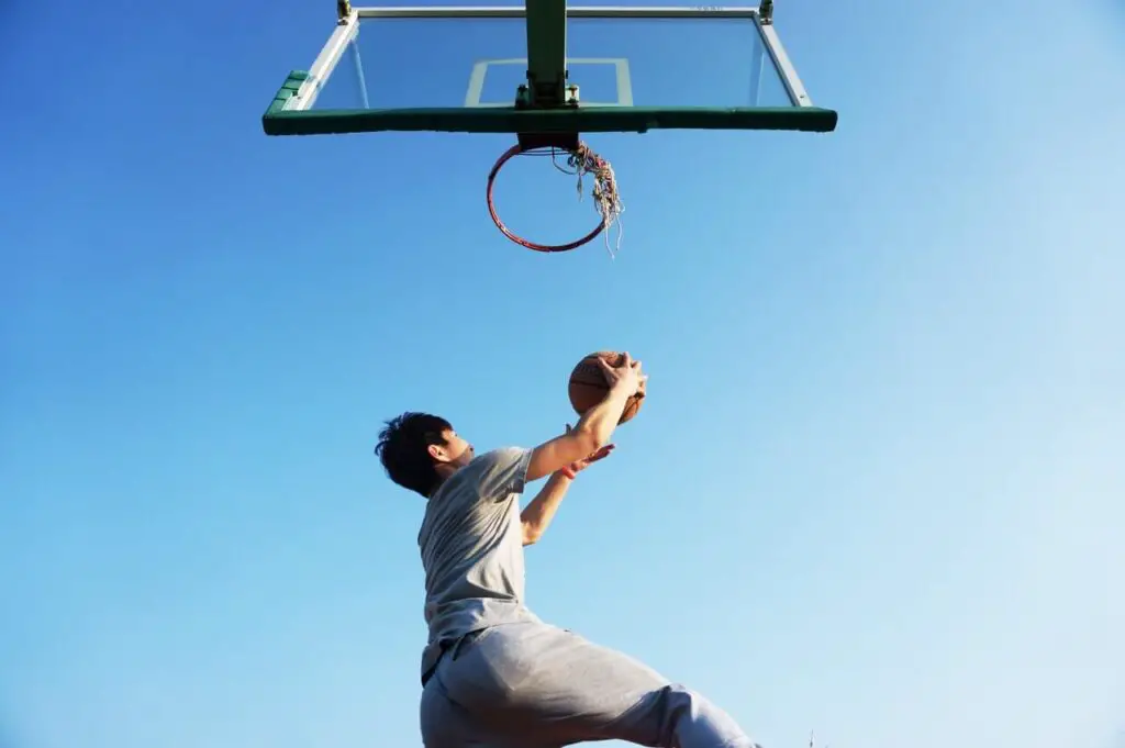 man dunking basketball ball