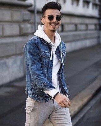 skinny guy wearing hoodie with denim jacket