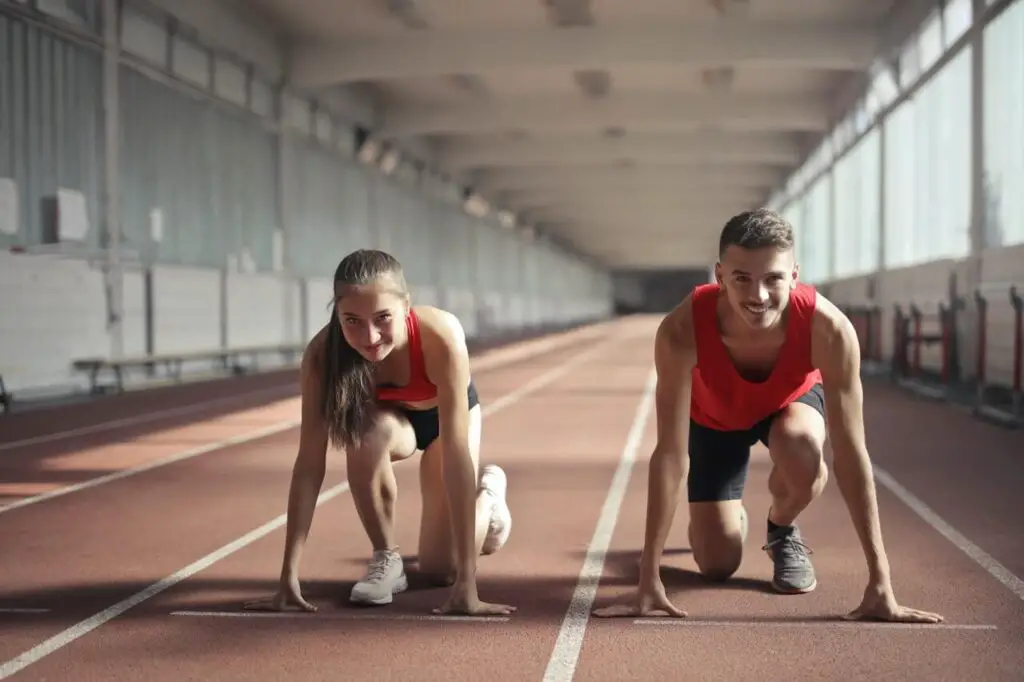 skinny guy and woman about to run