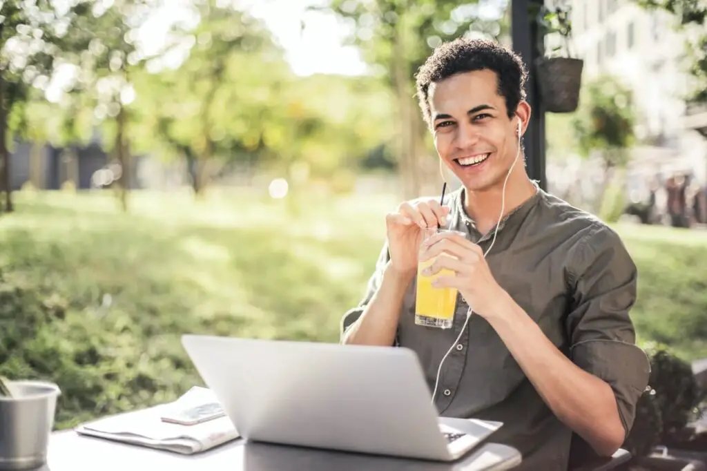 skinny guy sitting in park