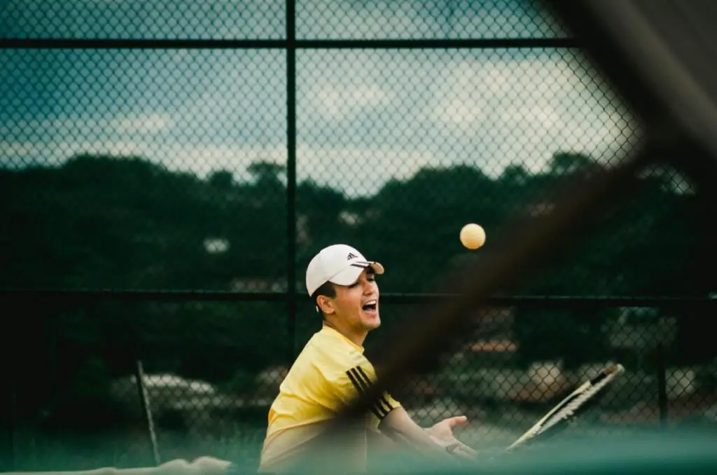 skinny guy playing tennis