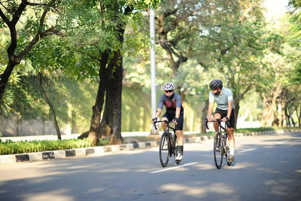 men riding bicycles on the street