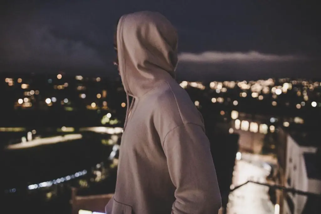 skinny guy wearing a pink hoodie