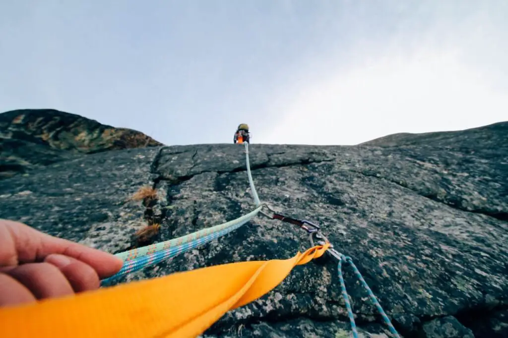 person mountain climbing