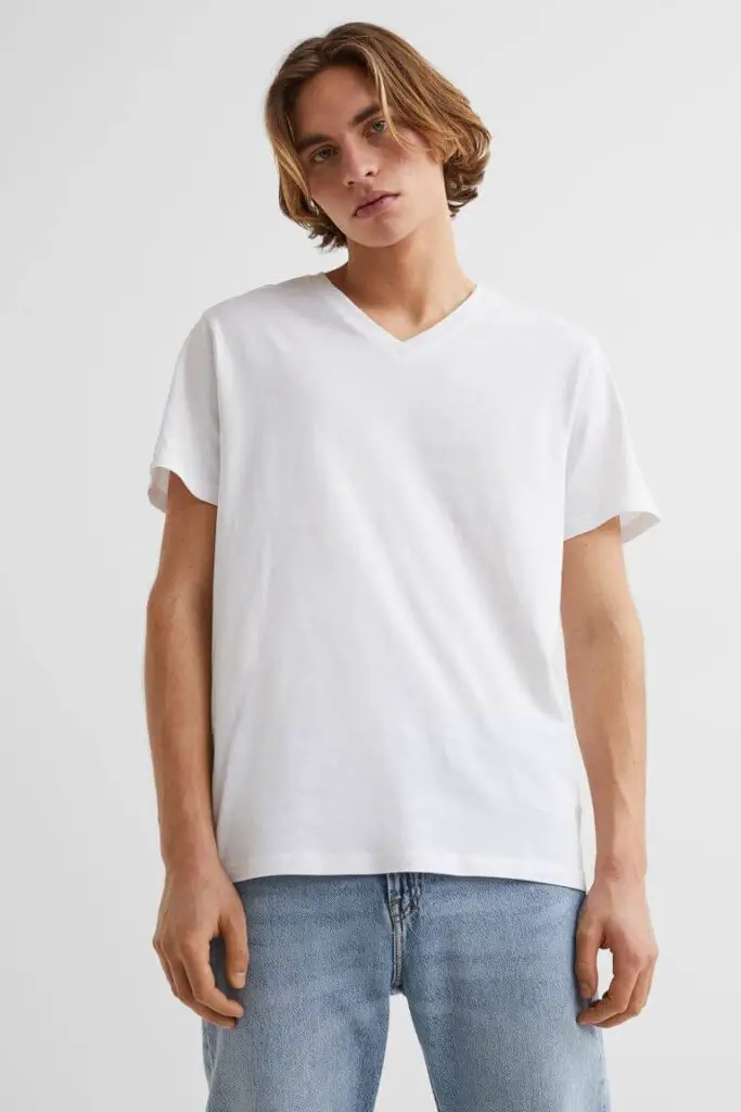 skinny guy wearing a white v-neck t-shirt